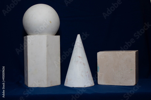 Plaster shapes cone circle square hexagon, blue background  photo