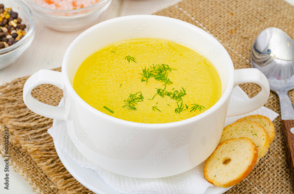Clear meat, chicken broth in white bowl. Studio Photo Clear meat, chicken broth in white bowl. Studio Photo