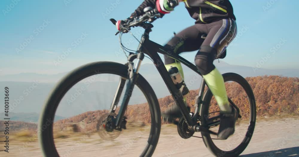 Man riding a bike trough the forest Man riding a bike trough the forest