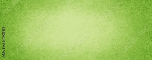 bright green background with light center and textured border design in Easter or spring colors and old vintage grunge texture