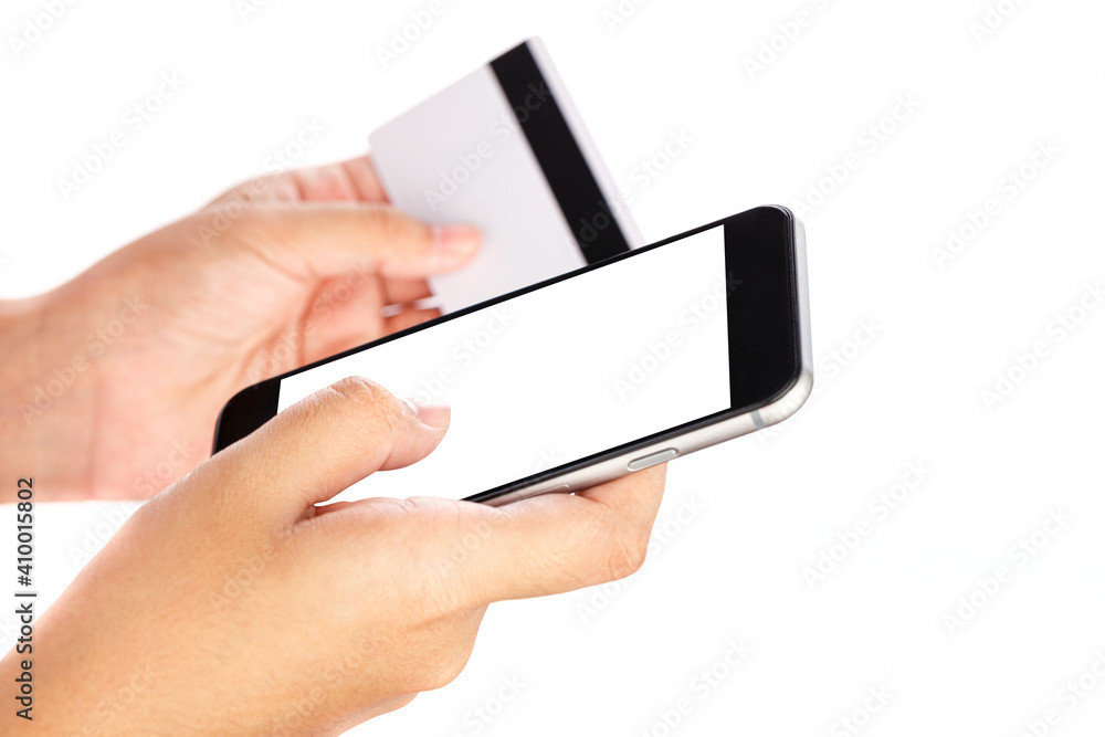 Woman hands holding mobile phone and credit card isolated on white background Woman hands holding mobile phone and credit card isolated on white background