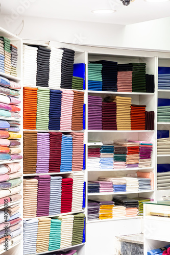 Arab store selling a variety of fabrics, Fabric in rolls