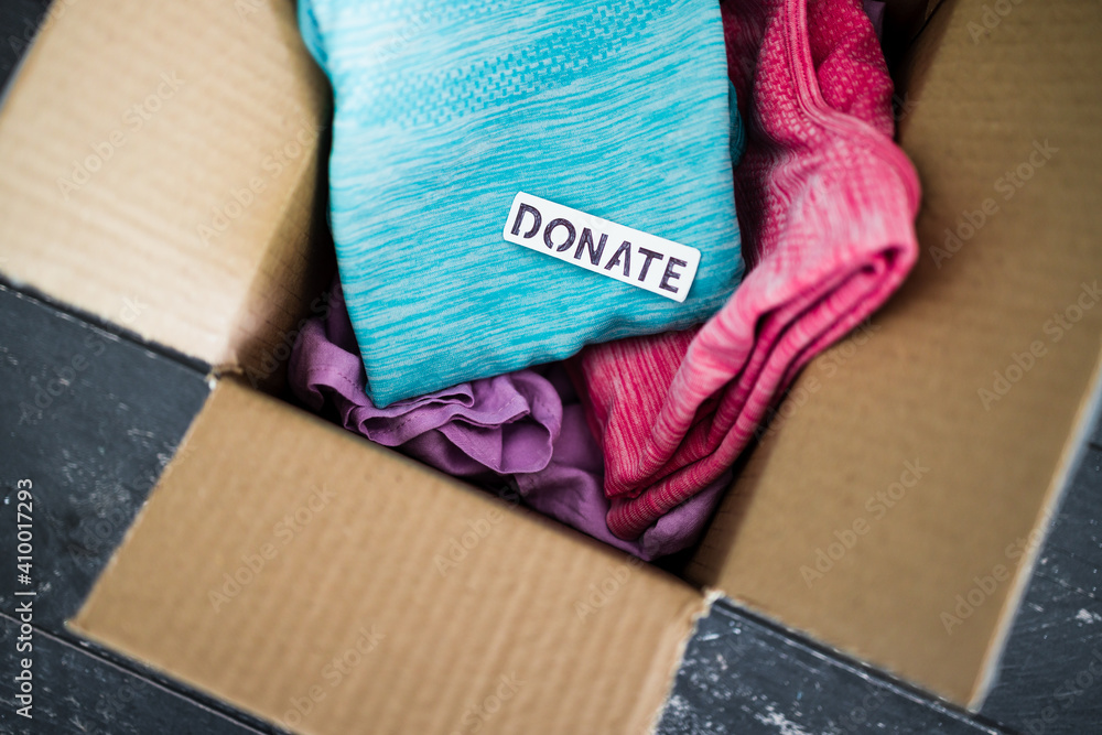 box with Donate label with secondhand items to be given away, charity