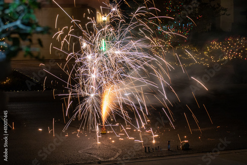 Shower of sparks from firecrackers in home driveway