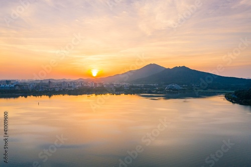 Sunrise over Xuanwu lake in Nanjing city in summer © SN