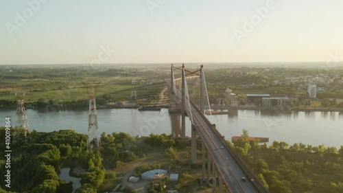 Pan left of Zarate Brazo Largo road and railway complex cable stayed bridge crossing Parana river and connecting Buenos Aires y Entre Rios at sunset, Argentina photo