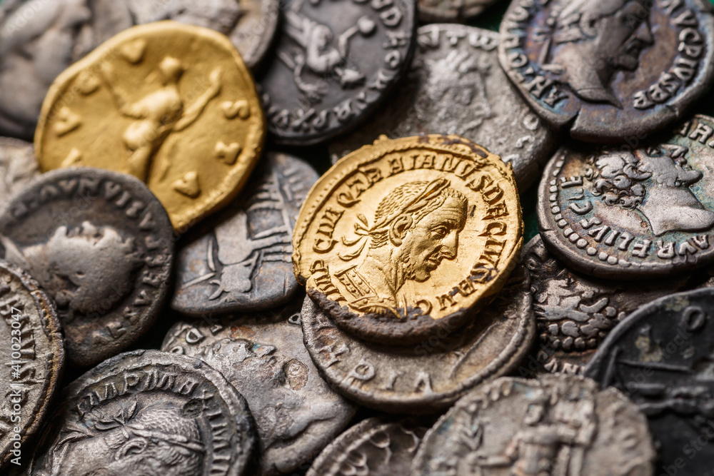 A treasure of Roman gold and silver coins.Trajan Decius. AD 249-251. AV  Aureus.Ancient coin of the Roman Empire.Authentic silver denarius,  antoninianus,aureus of ancient Rome.Antikvariat. Stock-Foto | Adobe Stock