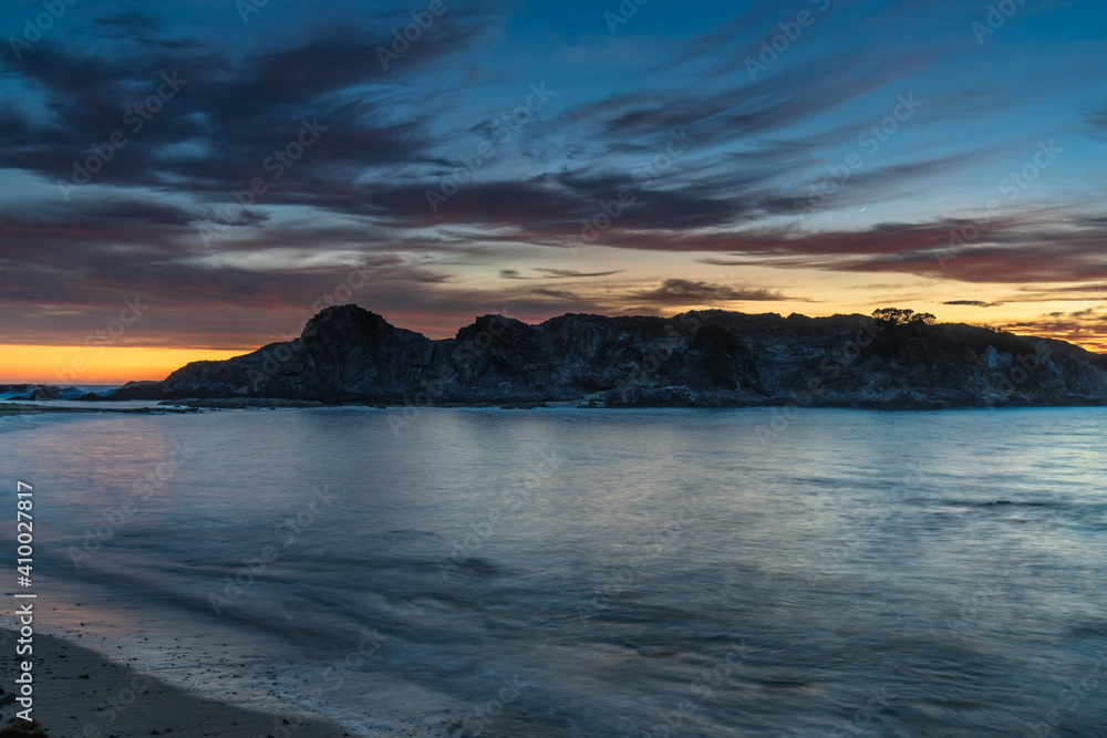 Colourful High Cloud Sunrise Seascape and Rock Formations