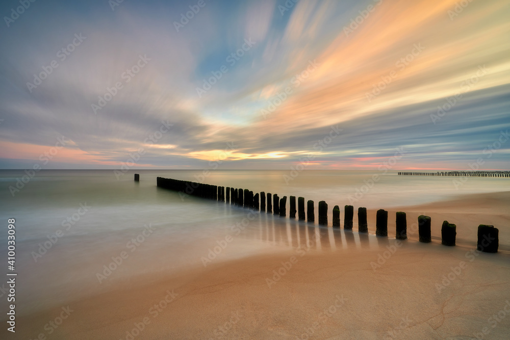 Beautiful sandy beach with a wooden breakwater. Polwysep Hel, village of Chałupy, Poland Beautiful sandy beach with a wooden breakwater. Polwysep Hel, village of Chałupy, Poland
