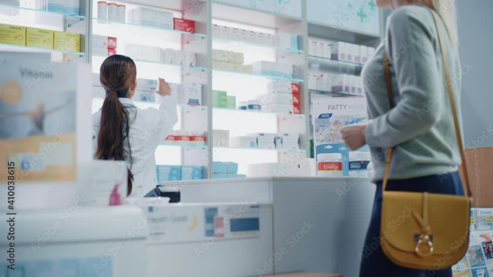 Pharmacy Drugstore Checkout Counter: Customer gives Prescription to Professional Female Pharmacist who Finds Medicine Package, Explains how to Use it, Client Pays Using Contactless Payment Terminal. Pharmacy Drugstore Checkout Counter: Customer gives Prescription to Professional Female Pharmacist who Finds Medicine Package, Explains how to Use it, Client Pays Using Contactless Payment Terminal.