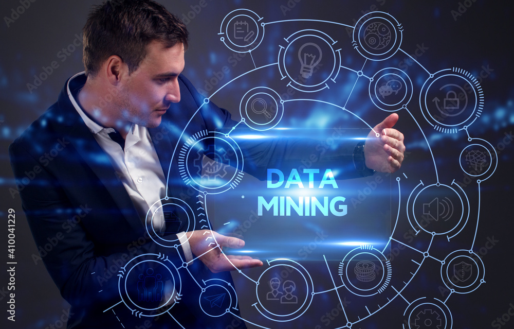 Business, Technology, Internet and network concept. Young businessman working on a virtual screen of the future and sees the inscription: Data mining Business, Technology, Internet and network concept. Young businessman working on a virtual screen of the future and sees the inscription: Data mining