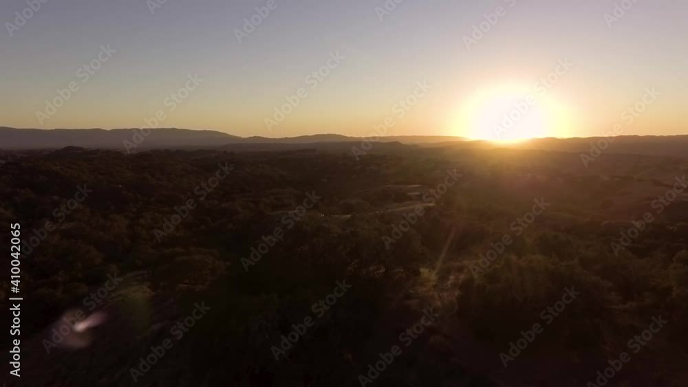 Low to high shot during beautiful sunset over California's rolling hills Low to high shot during beautiful sunset over California's rolling hills