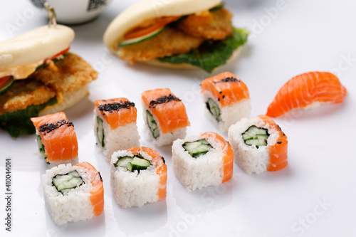 Philadelphia roll with cucumberon and appetizing fresh sushi white background. Sushi menu. Japanese food.