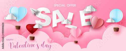 Valentine day's specials offer with sale wording in white frame and red harts on pink cloud and bokeh pattern background. Valentine greeting card in paper cut style and vector design.