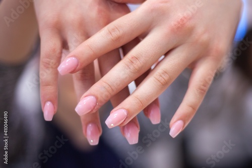woman s hands with fresh painted nails