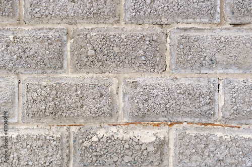 Grey Brick wall with a Sprinkle of white stucco background texture. abstraction