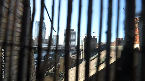 view at London from a rooftoop behind the wooden fence, on a sunny day, dramatic look photo