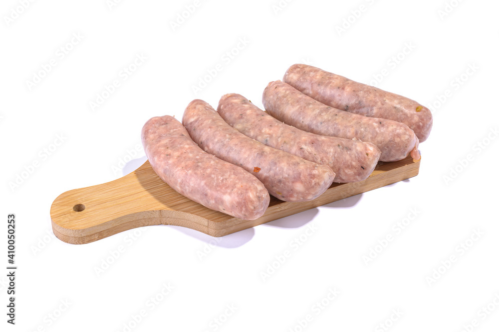 Raw pork sausages.Grilled sausages in close-up, isolated on a white background.Selective focus. Raw pork sausages.Grilled sausages in close-up, isolated on a white background.Selective focus.