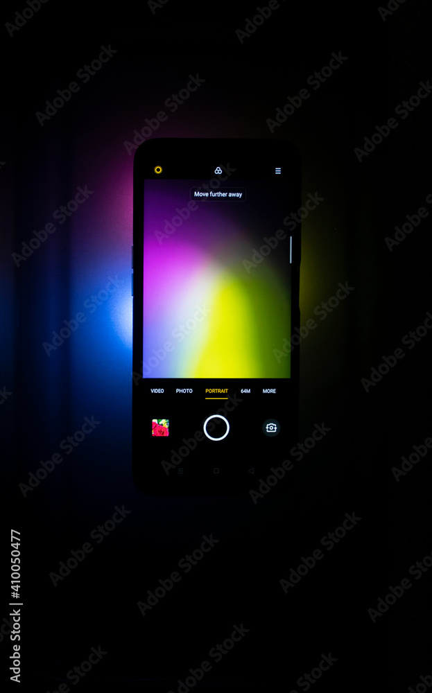 Background macro image pattern made of folded curved sheets of paper with multi color light illuminate Background macro image pattern made of folded curved sheets of paper with multi color light illuminate