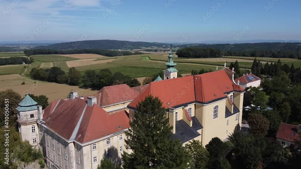 Drone is flying over by a Church tower from above. Old Austrian Church in Heiligenkreuz Gutenbrunn Drone is flying over by a Church tower from above. Old Austrian Church in Heiligenkreuz Gutenbrunn
