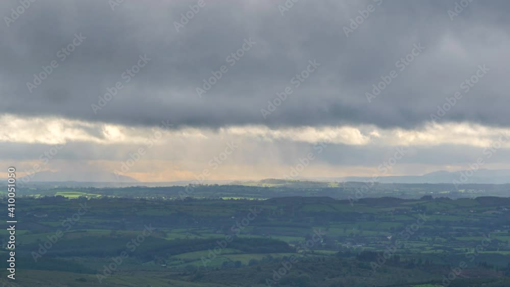 Time lapse of countryside landscape with hills and fields on a cloudy dramatic day in rural Ireland Time lapse of countryside landscape with hills and fields on a cloudy dramatic day in rural Ireland