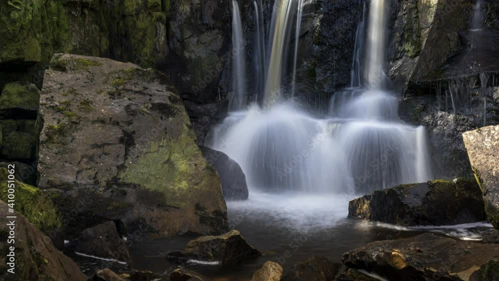 Time lapse of local waterfall in rural forest landscape of Ireland on a summer sunny day. Time lapse of local waterfall in rural forest landscape of Ireland on a summer sunny day.
