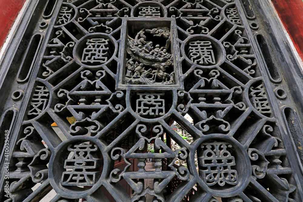 Brick carving window flowers in Yu Garden, Shanghai, China Brick carving window flowers in Yu Garden, Shanghai, China