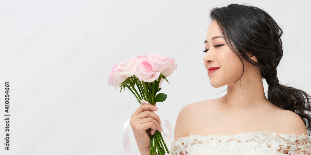 Portrait of a beautiful girl with a bouquet of roses. Beauty and fashion. Portrait of a beautiful girl with a bouquet of roses. Beauty and fashion.