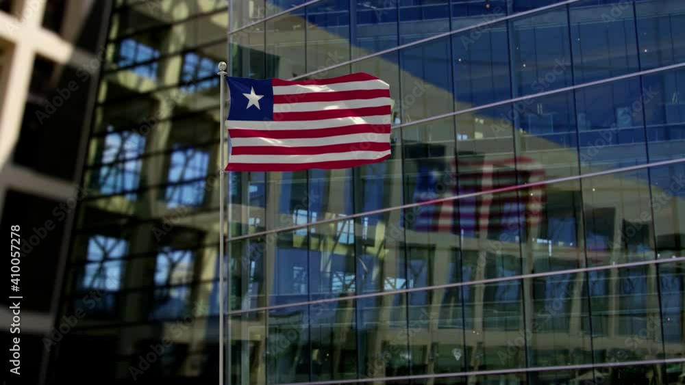 Liberia Flag Waving On A Skyscraper Building Liberia Flag Waving On A Skyscraper Building