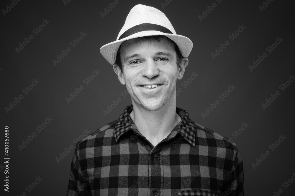 Portrait of tourist man ready vacation smiling shot in black and white Portrait of tourist man ready vacation smiling shot in black and white