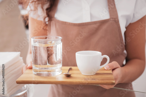 Barista serving refreshing ...