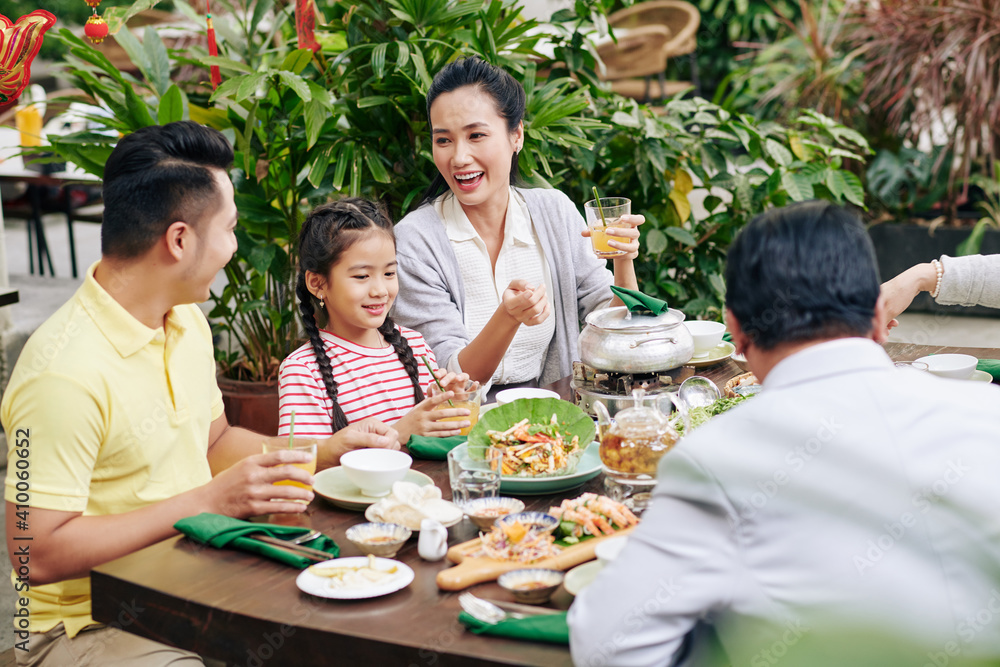 Vietnamese couple celebrating Lunar New Year with daughter and senior parents Vietnamese couple celebrating Lunar New Year with daughter and senior parents