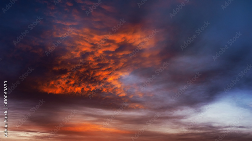 Colorful sunset clouds with fiery red cloud