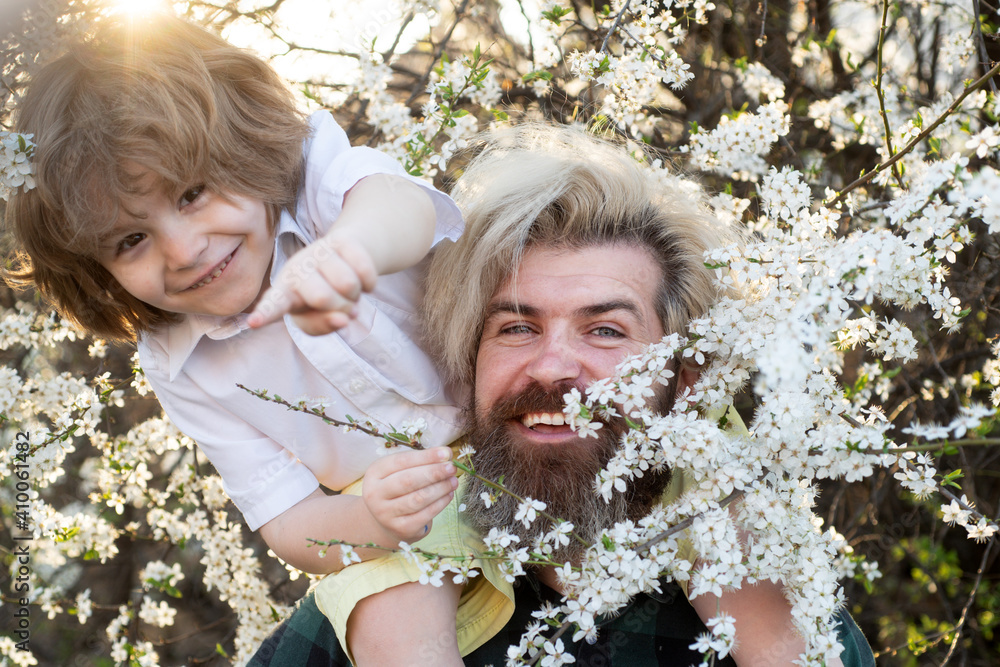 Family relationships and problems. Child with dad in summer park. Shoulder ride. Family relationships and problems. Child with dad in summer park. Shoulder ride.