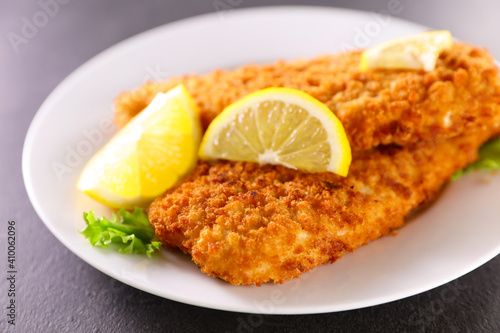 crispy breaded fish fillet and lemon