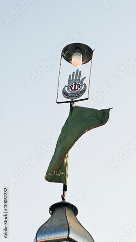 Photo Alam of Hazrat Abbas flying high in the sky HD Portrait Muslim Wallpaper