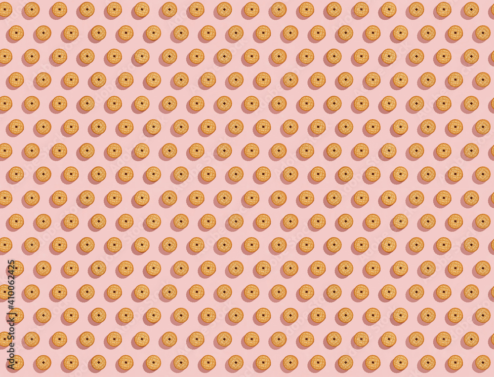 Biscuits stuffed with cream on a bright pink background, a recurring seamless pattern, sweet background, wallpaper. Copy space, banner. top view Biscuits stuffed with cream on a bright pink background, a recurring seamless pattern, sweet background, wallpaper. Copy space, banner. top view