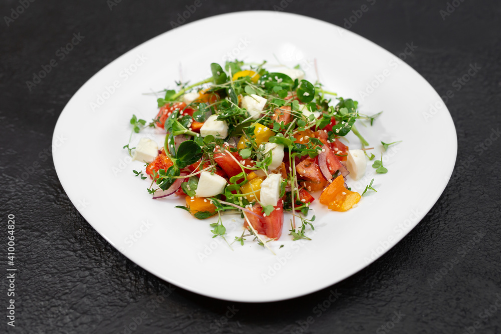 salad with fresh vegetables, microgreens and feta cheese. salad with fresh vegetables, microgreens and feta cheese.