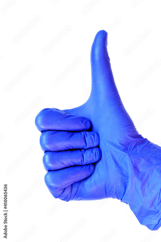 Blue latex medical gloves on a female hand, shows the okay