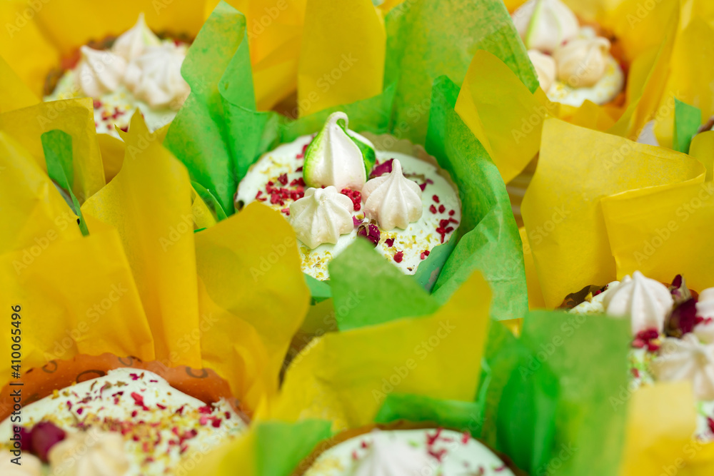 Sweet Easter cakes decorated in yellow-green paper