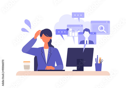 Multitasking businesswoman working on computer.