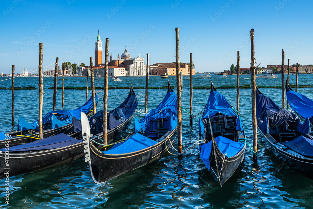 Empty gondolas near St. Mark's Square with the Church of San Giorgio Maggiore in the background, Venice, Italy