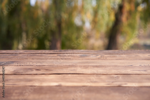 Empty wooden table nature bokeh background with a country outdoor theme,Template mock up for display of product