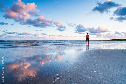 Hiker standing at sea