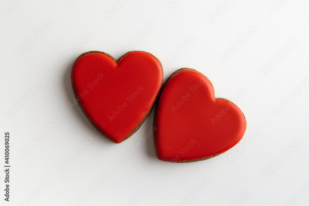 Two red gingerbread hearts on white background, top view. Valentines day