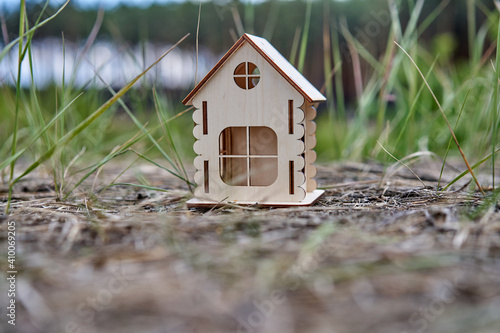 Miniature wooden house outdoor nature. Real estate concept. Modern housing. Eco-friendly energy efficient house. Buying home outside the city Fresh air.