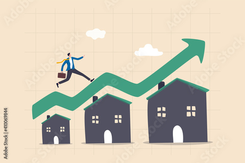 Housing price rising up, real estate or property growth concept, businessman running on rising green graph on house roof.