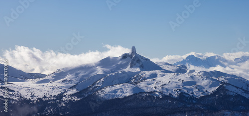 Beautiful Aerial Panoramic View of Black Tusk and Canadian Nature Landscape covered in Snow during winter. Taken on top of Whistler Mountain, British Columbia, Canada. Nature Background Panorama.