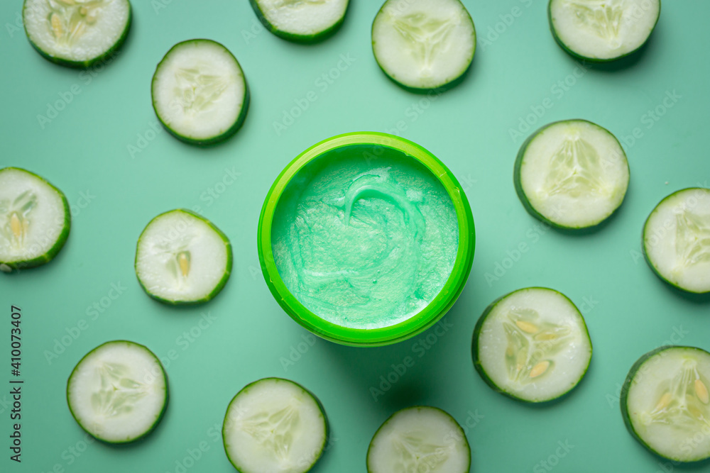 face mask with cucumber slices on light green background face mask with cucumber slices on light green background