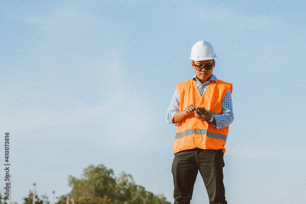 Civil engineer at construction site using computer laptop checking work. Management in the construction site. Civil engineer at construction site using computer laptop checking work. Management in the construction site.